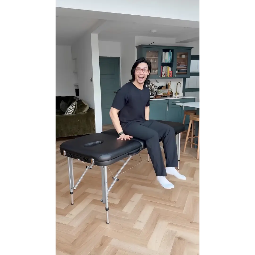 Earthworks Perform portable massage table featuring a lightweight aluminium frame and high-strength cable system; used in a home-visit setting in Manchester to solve the problem of frame flexing or side-slipping when a therapist applies direct downward or edge-sitting pressure.