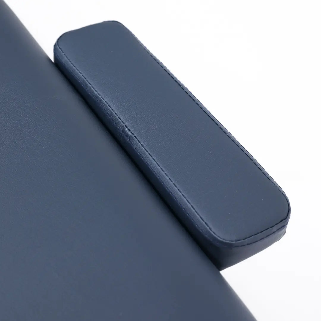 Close-up of the Porta-Lite Classic portable massage table showing the stain-resistant PU vinyl upholstery, precision-stitched rounded corners, and dual-end headrest accessory ports; a detailed view of the durable table top texture that solves the problem of premature fabric cracking and stripping from everyday massage oils and harsh sanitisation routines for mobile and home-based therapists in Liverpool.
