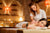 Female Massage therapist gives a young woman a massage in spa setting