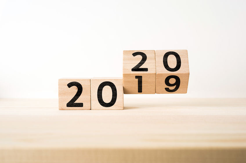 surreal abstract geometric floating wooden cube with word  2020 & 2019  concept on wood floor and white background