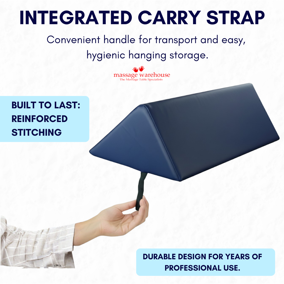 Navy wedge bolster massage cushion with integrated carry strap on a white background, featuring Massage Warehouse branding.
