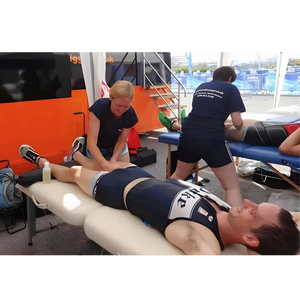 Porta-Lite Delta 2 portable massage table featuring an aircraft-grade aluminium frame, secure cable lock system, and 6.5cm high-density multi-layer foam padding; an essential lightweight sports therapy couch used at an outdoor athletics race in Newcastle to solve the problem of table wobble and frame flexing during high-pressure post-race hamstring flushing and deep tissue bodywork.
